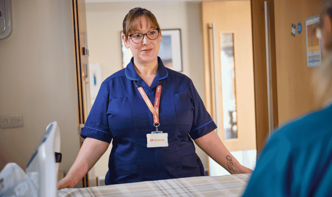 Hospice nurse by bedside