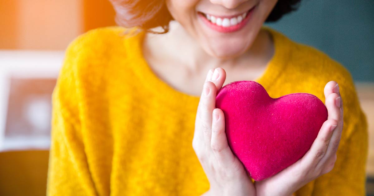 Women holding a heart