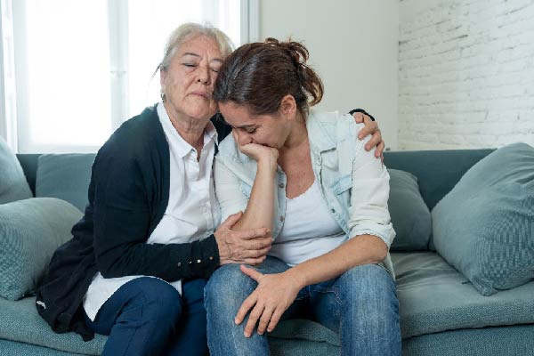 Mother comforting daughther