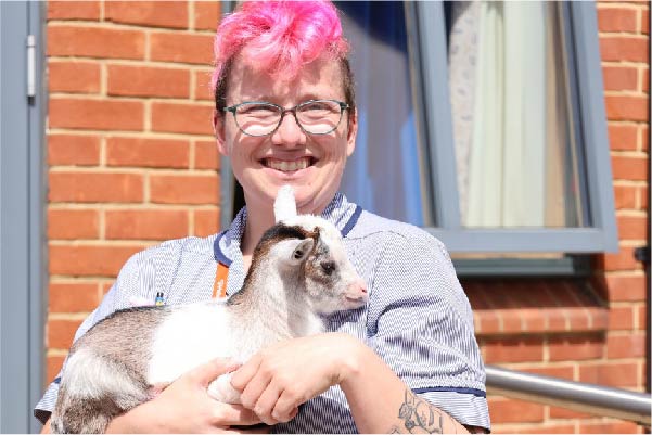 St Helena Hospice nurse with goat