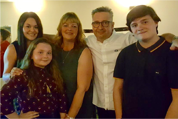 Caitlin and her family together with mum Tracy
