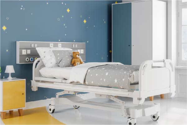 Hospital bed in a children's ward with a teddy sat on it