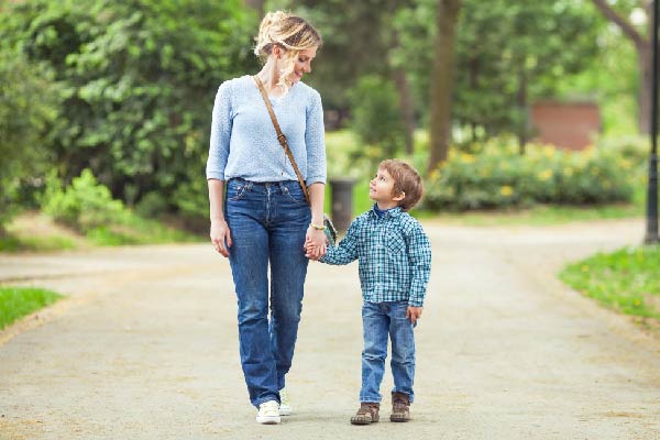 Mother and son walking